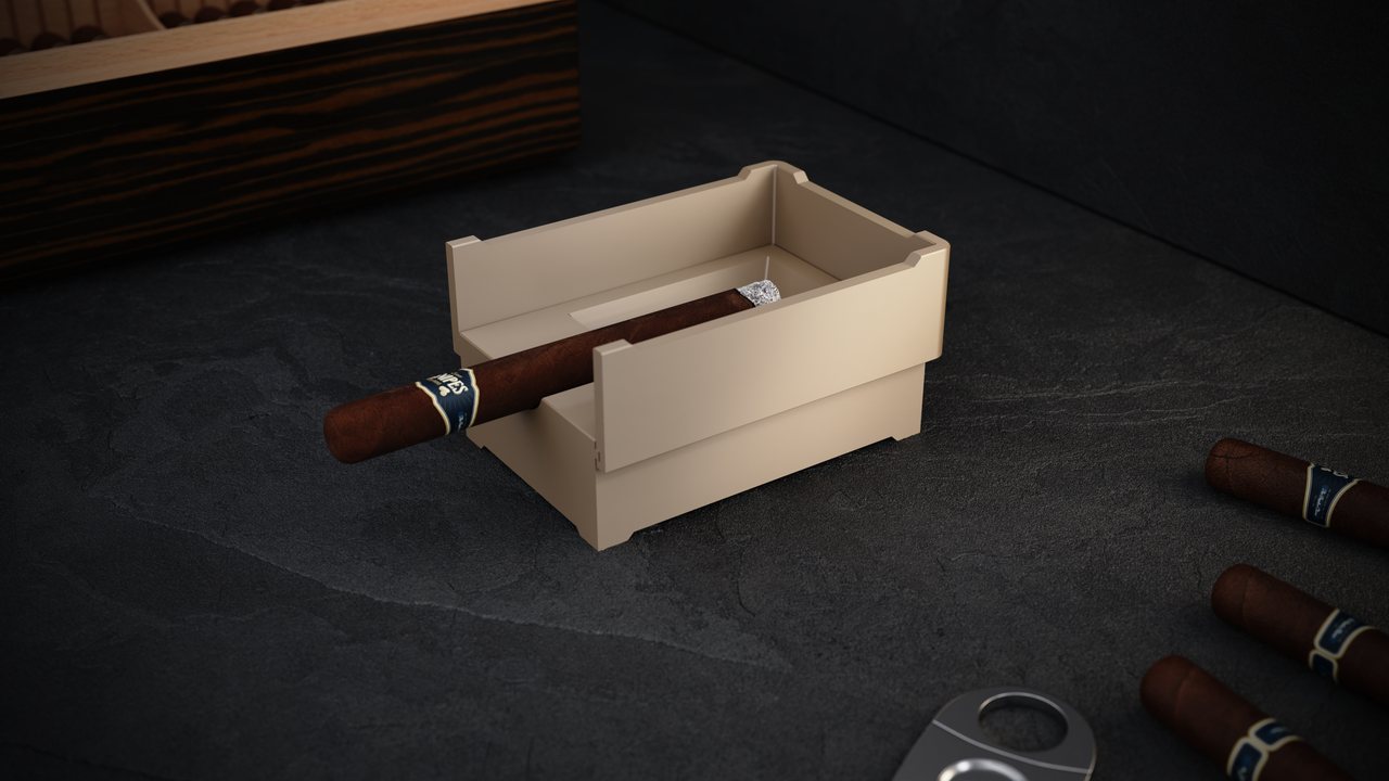 Fortress in ivory on a dark stone table, a cigar resting in the cut